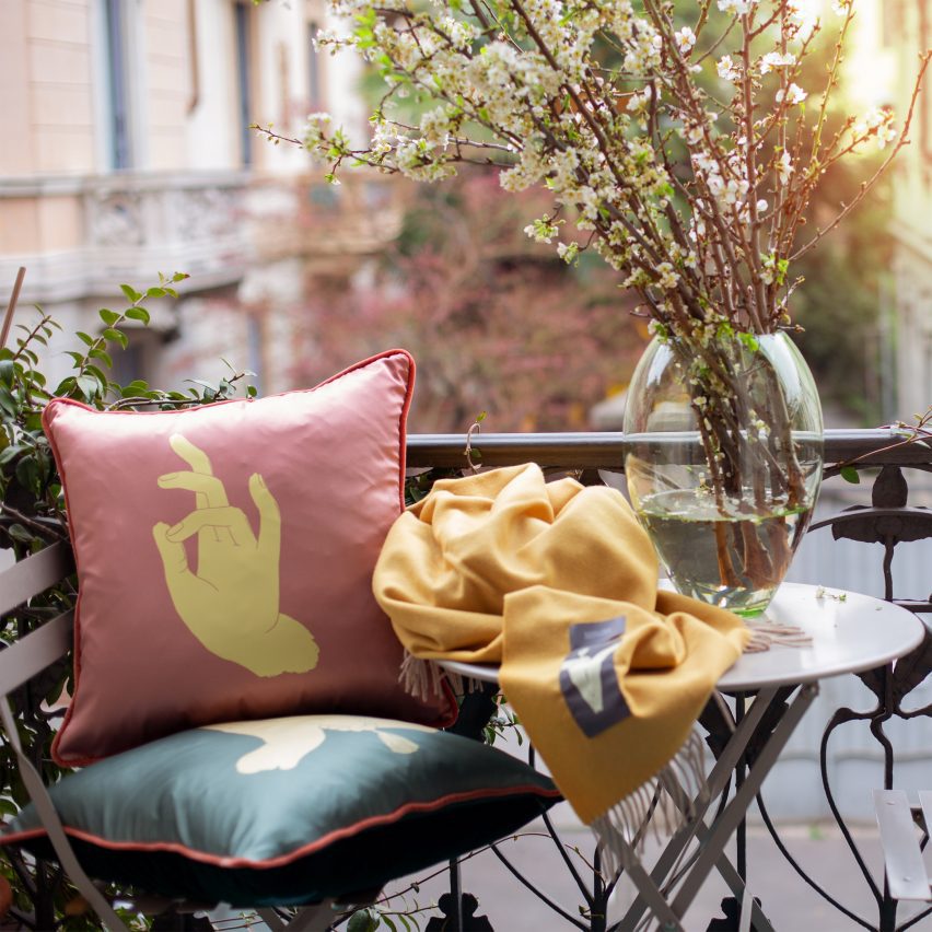 Photo of cushions and a blanket on a balcony