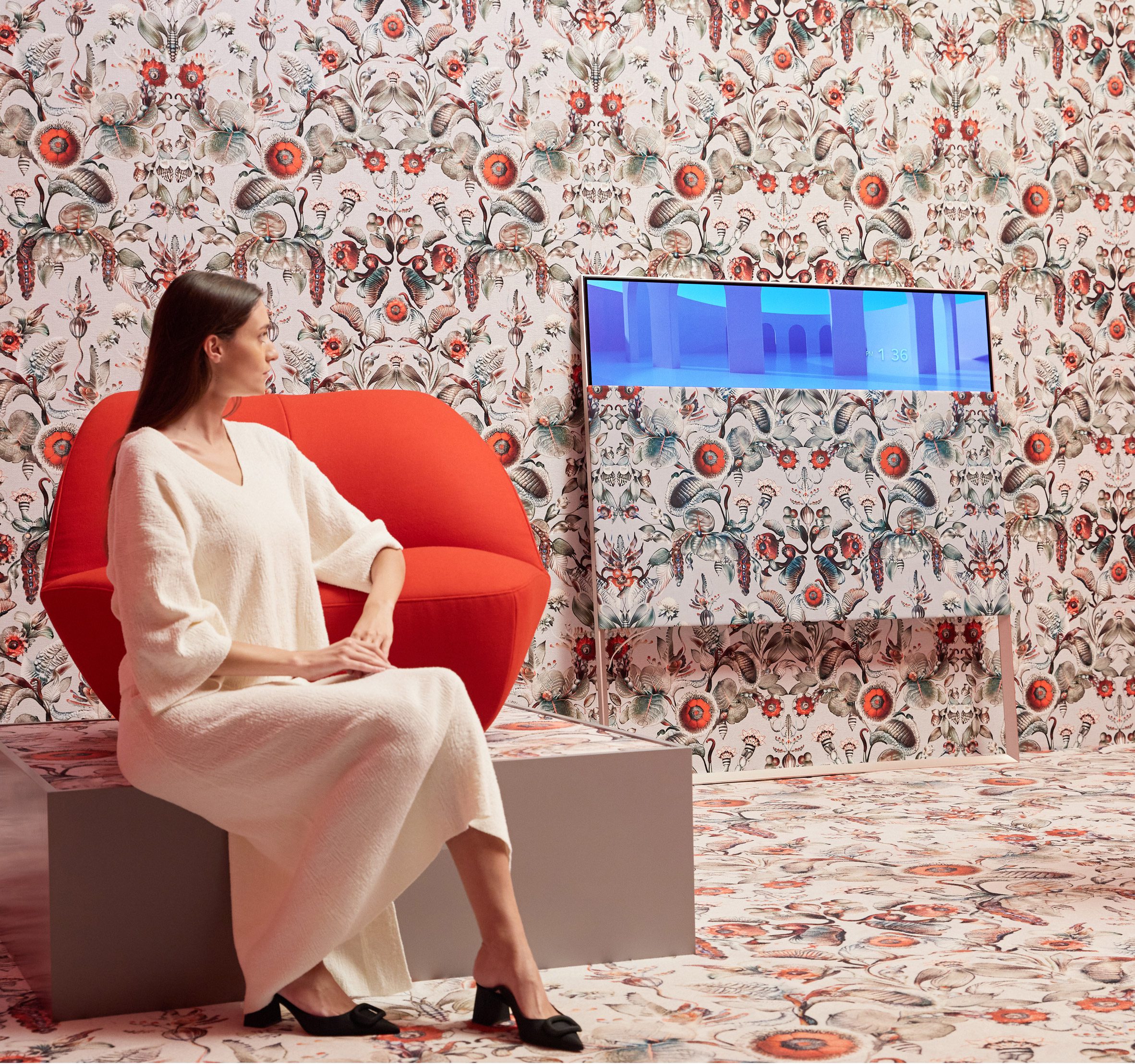 Model sitting in front of Moooi screen