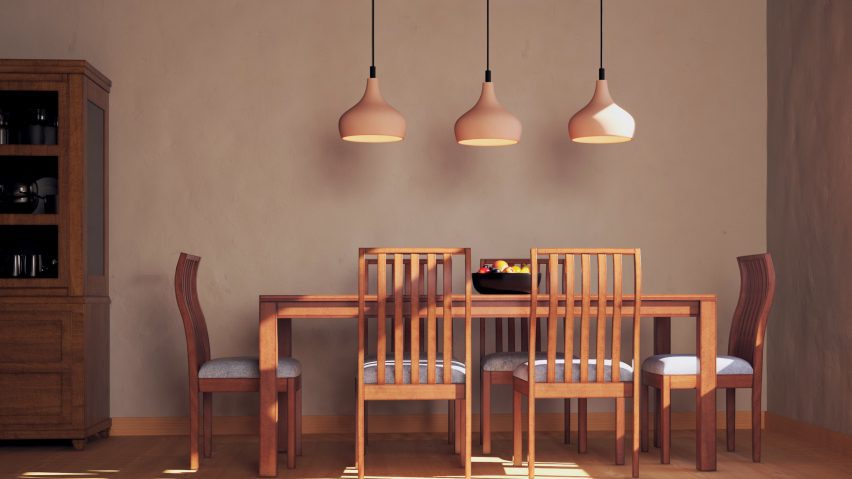 Photo of three pendant lights above a wooden table and chairs