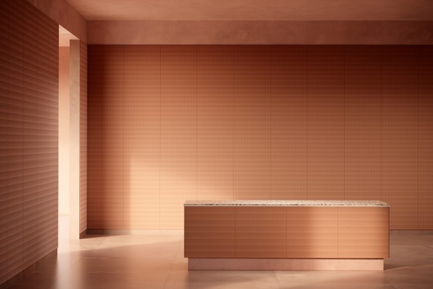 A room lined in terracotta-coloured Alted H01 tiles by Berta Julià Sala for Alted Materials 