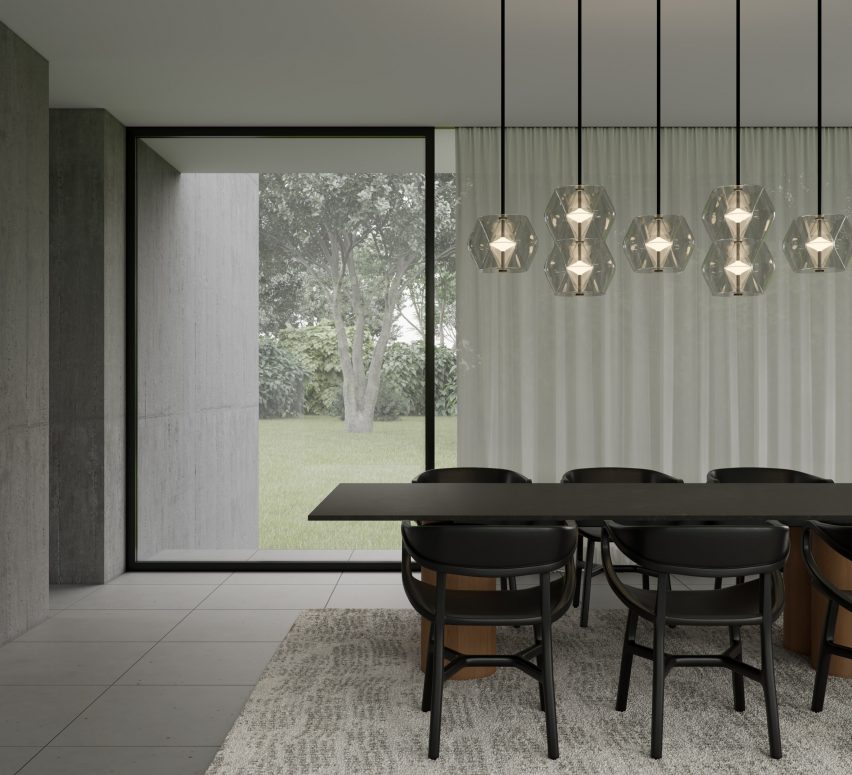 Argyle pendant lights by Rakumba over a dark wood table in a dining room