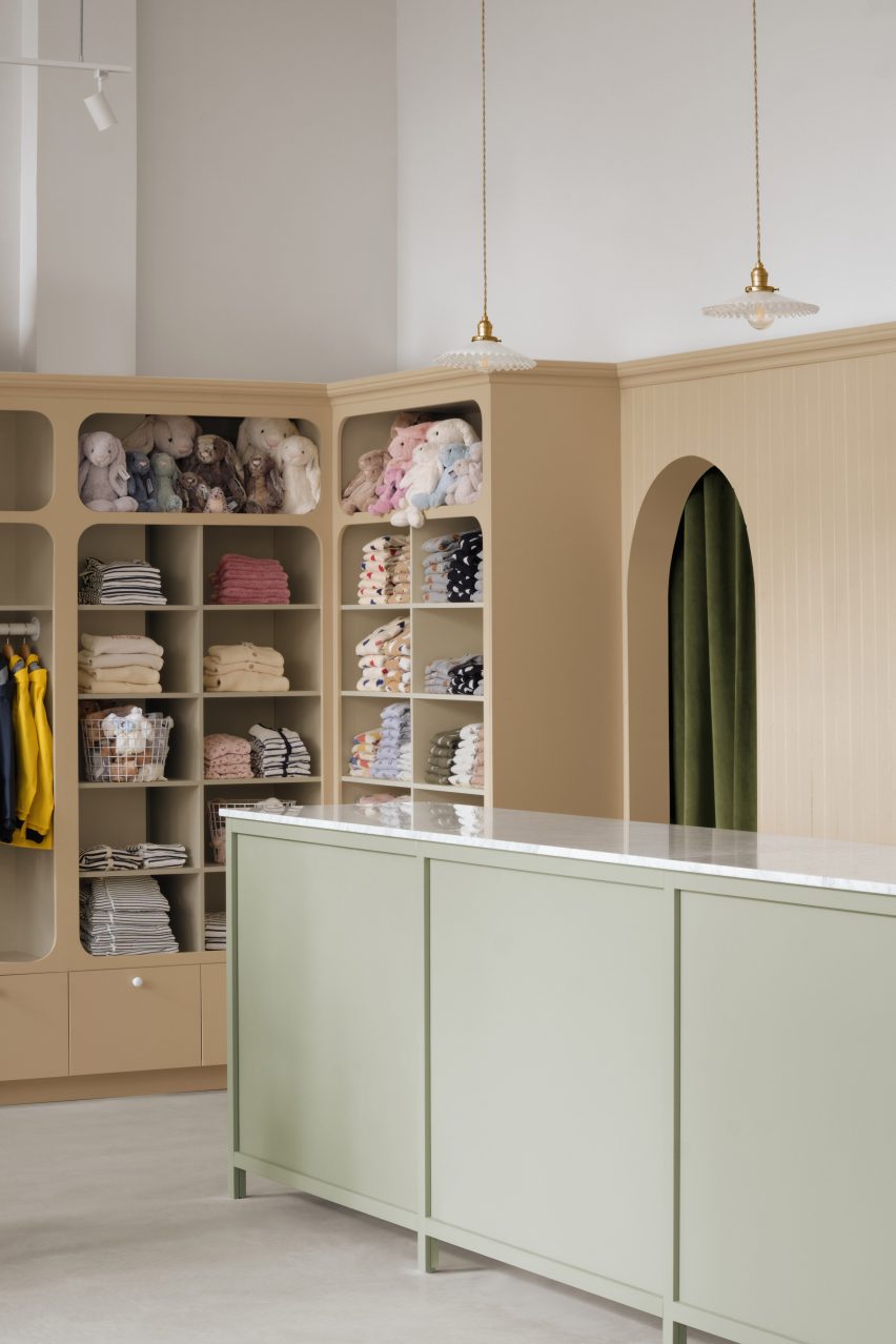 Storage cupboard and counter in store interior by Vives St-Laurent