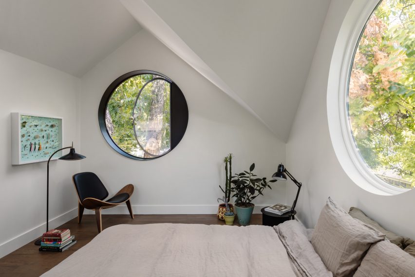 Circular pivot window in gabled roof