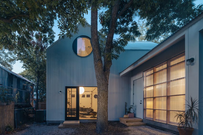 Corrugated metal structure by North Arrow Studio placed around trees