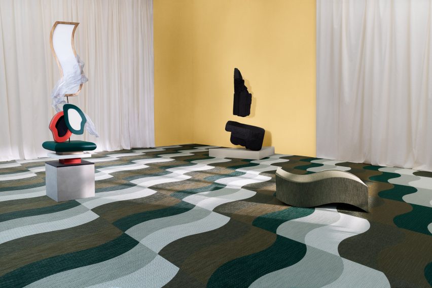 Curving green carpet tiles by Bolon