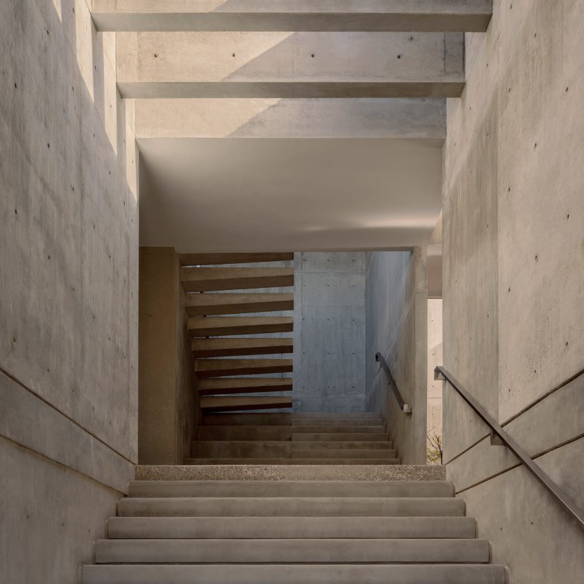 Statement staircase with floating concrete treads