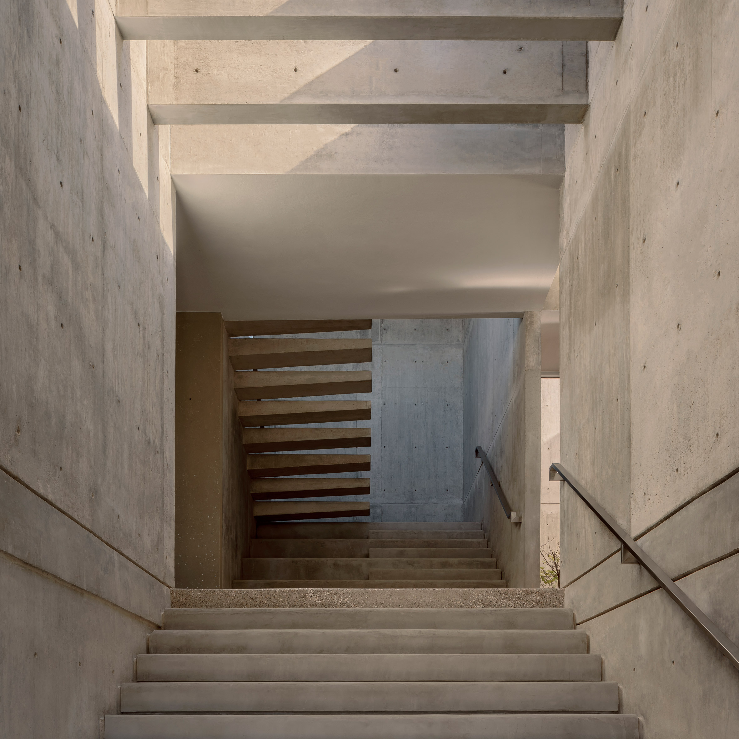 Statement staircase with floating concrete treads