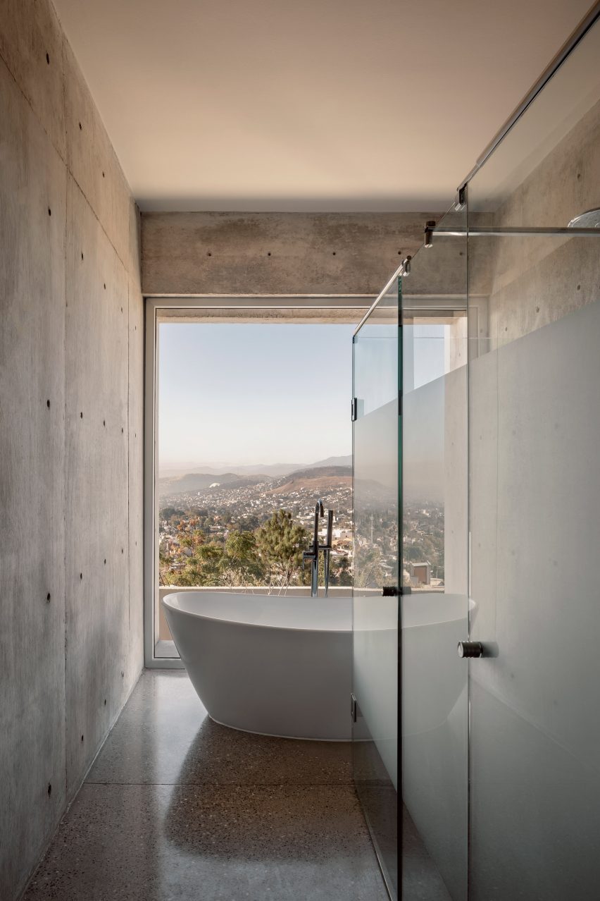 Bathroom with standalone tub and a view of the Oaxacan hillside
