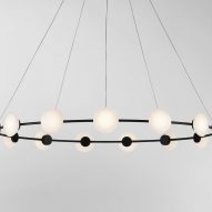 Ceto Circlet chandelier by Ross Gardam with clear glass and black frame