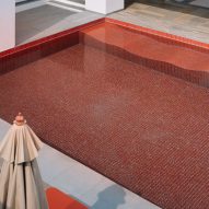 Outdoor swimming pool with red tiles