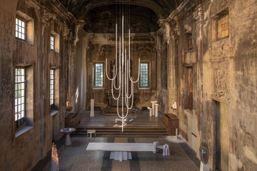 Strand-light chandelier hung from the ceiling of a Milanese church
