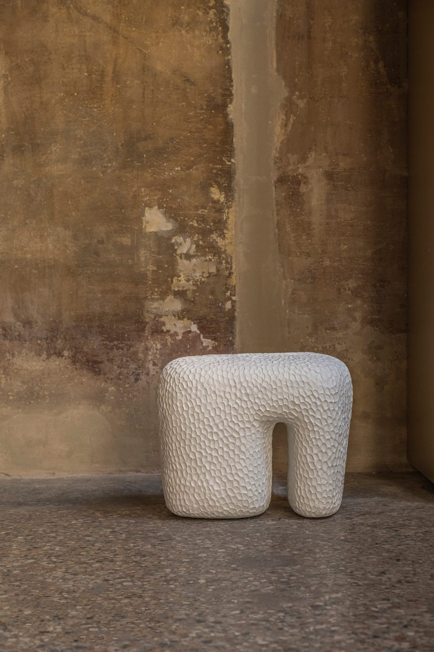 Punched sculpted white stool