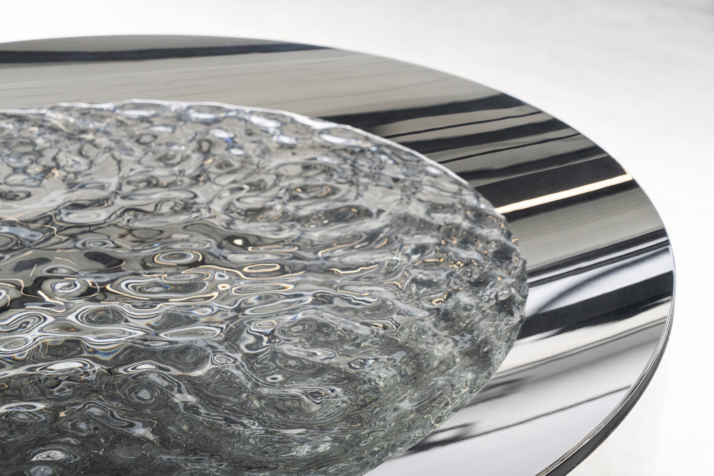 Ripping water in a stainless steel basin by Lachlan Turczan
