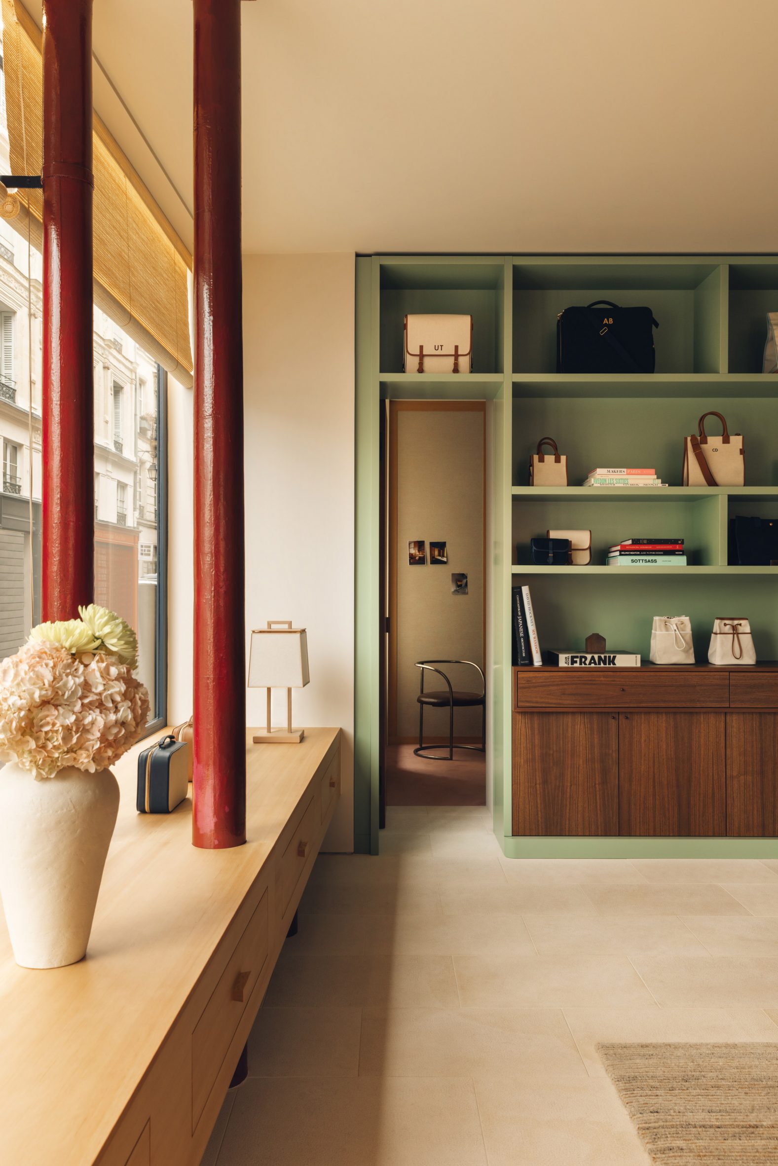 Mint green display cabinets in boutique in Paris by Halleroed