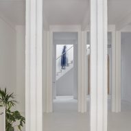 Interior with white walls, floors and square columns