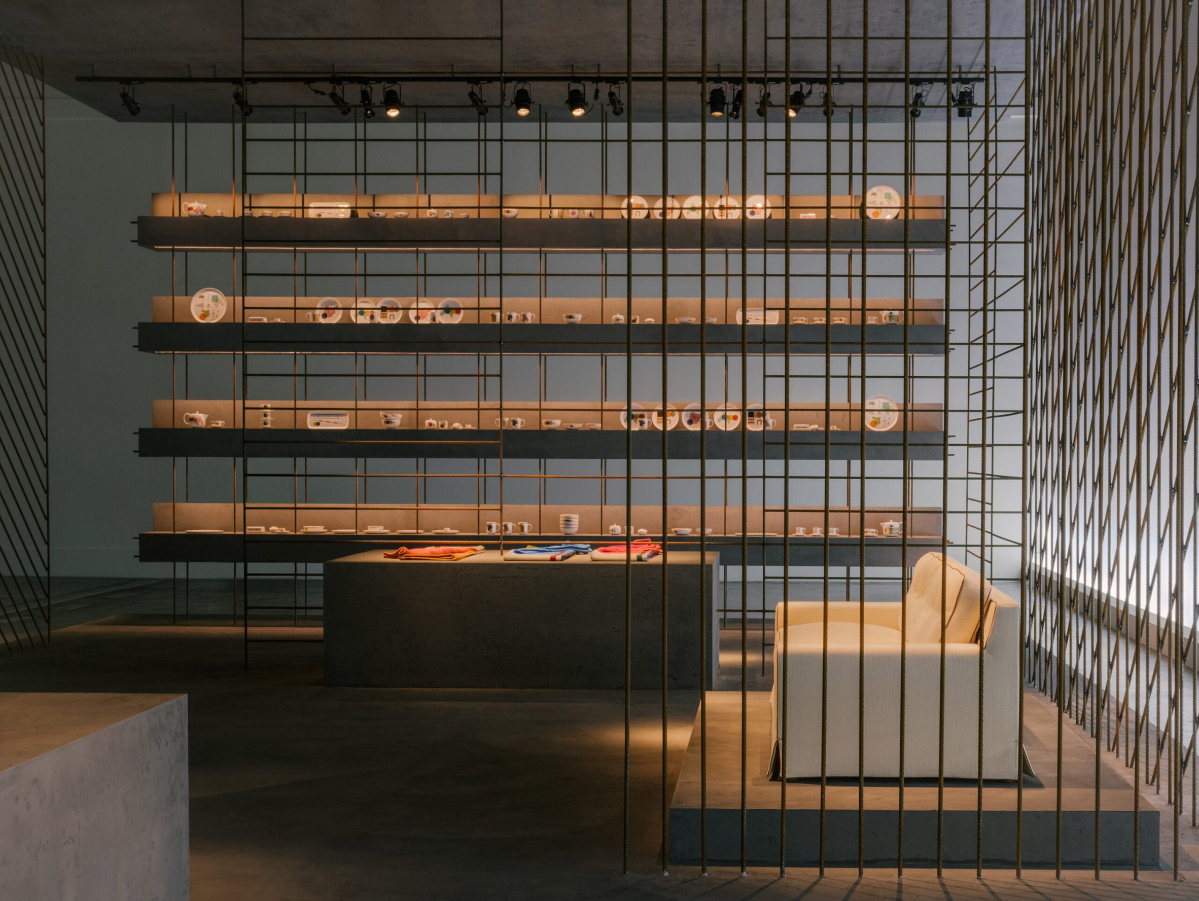 interview: Hermès encloses new home collections in transparent iron rod  installation in milan