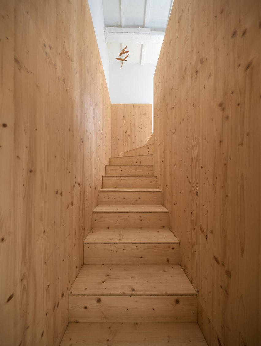 Wooden staircase in hotel in Menorca by Emma Martí Arquitectura