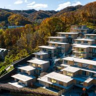 Kengo Kuma nestles staggered housing complex on Japanese hillside