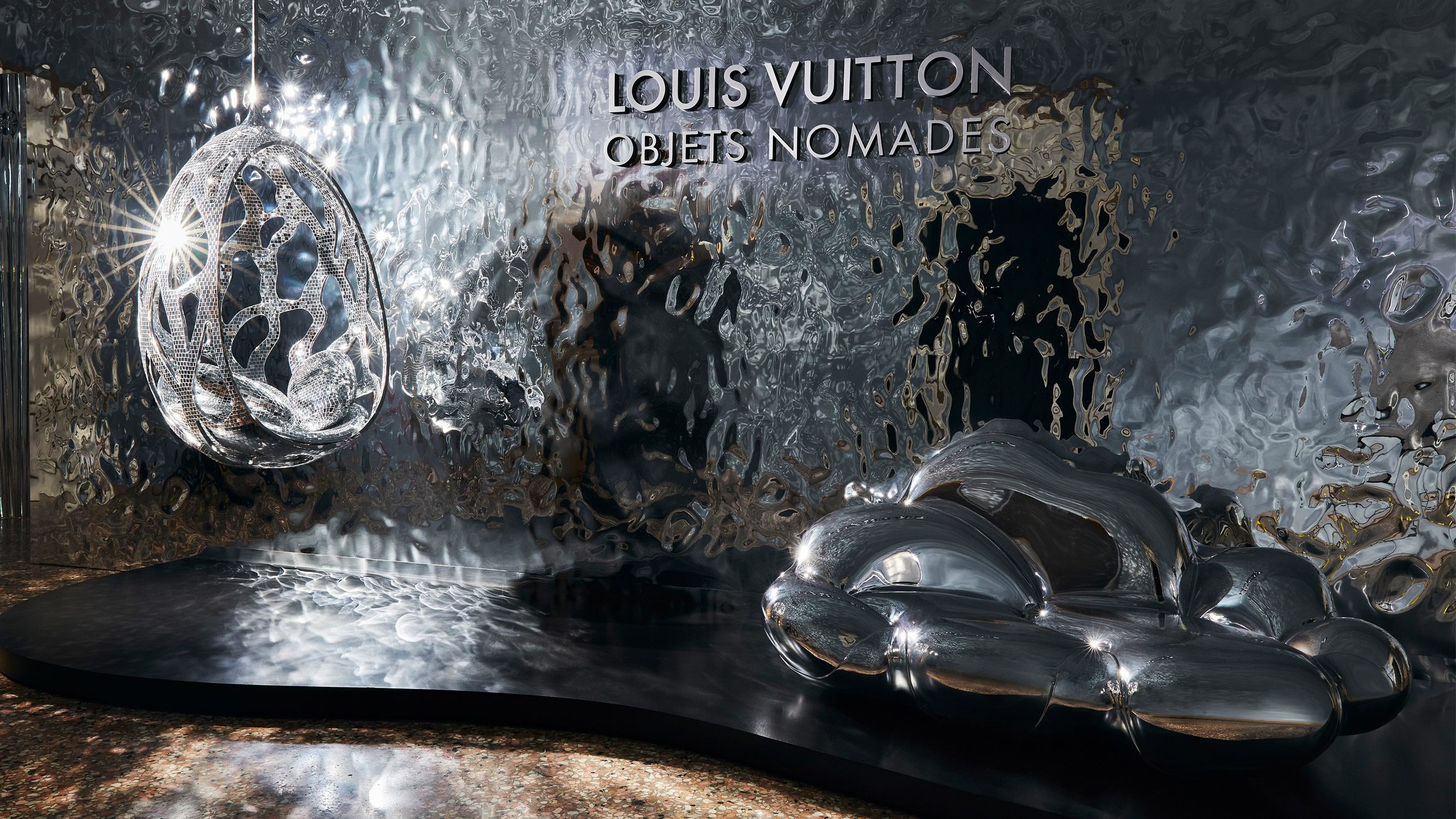Reflective wall within Louis Vuitton Objets Nomades exhibition