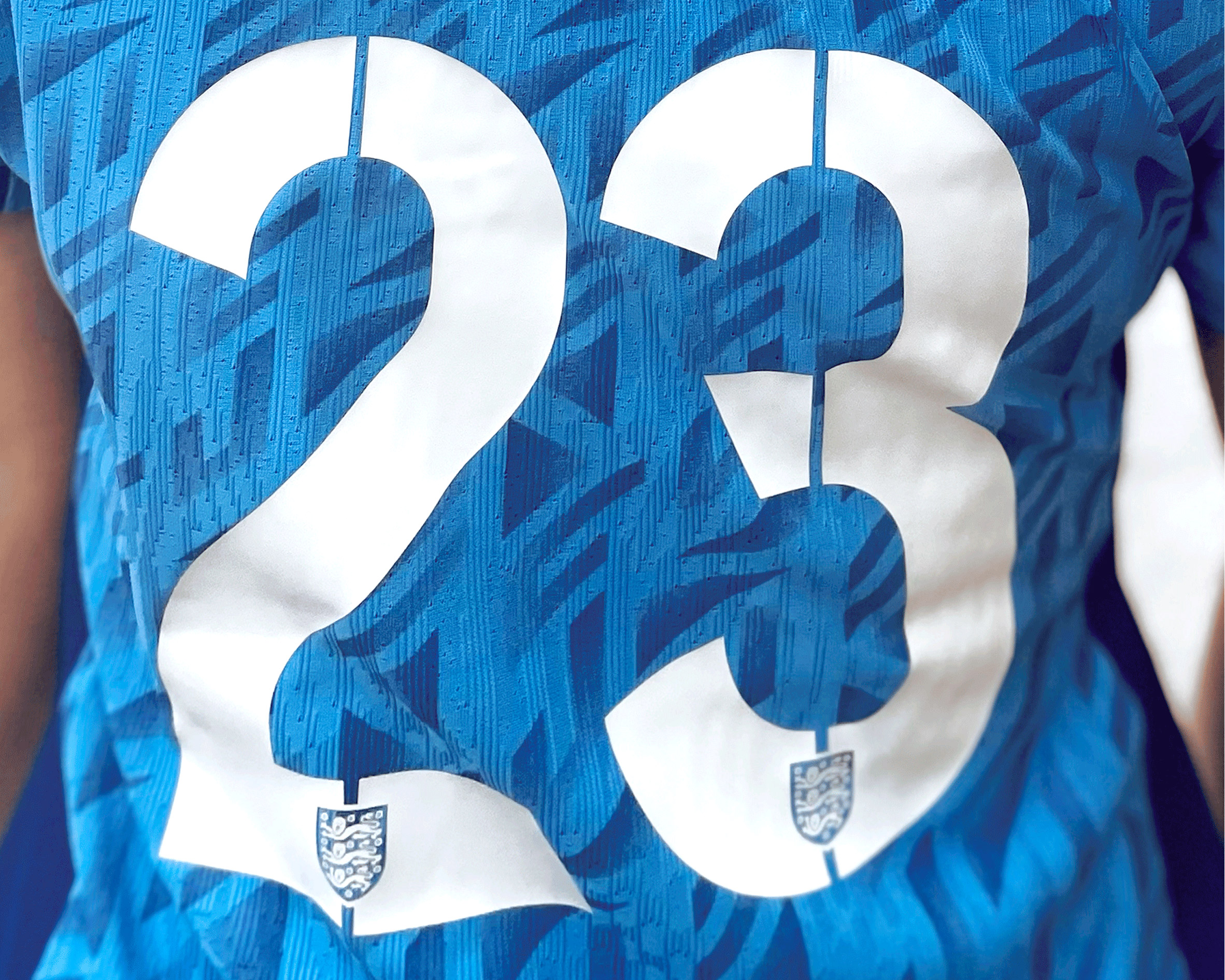 Stencil-like typeface by Neville Brody on the back of a football shirt