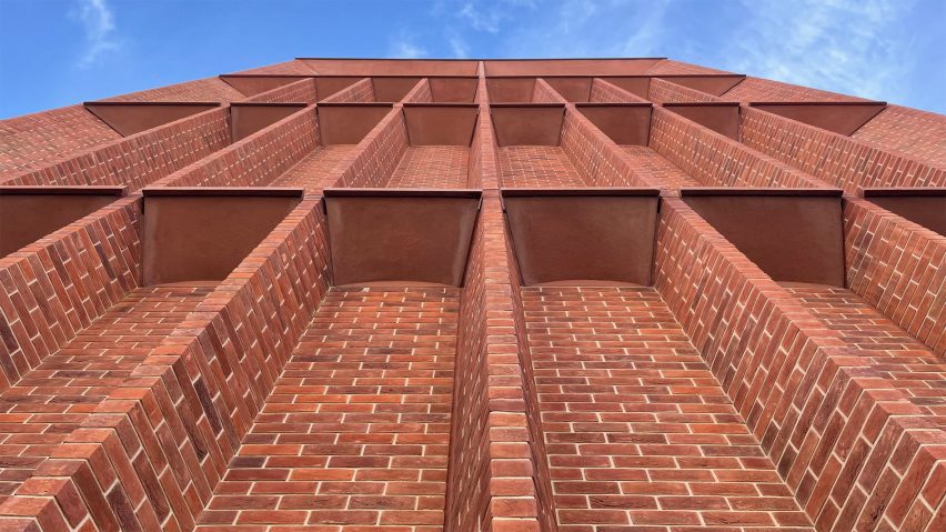 Red-brick bays on hte exterior of the International Rugby Experience building by Niall McLaughlin Architects