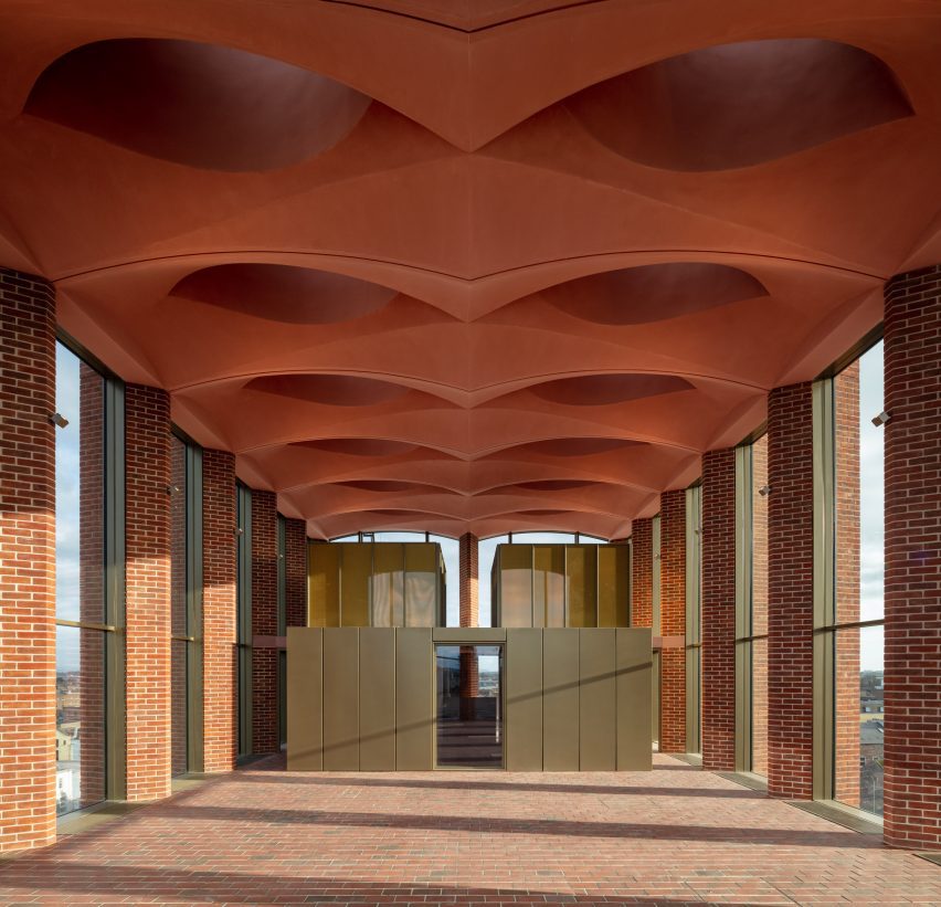 Red-brick exhibition space with vaulted ceiling at the International Rugby Experience building by Niall McLaughlin Architects