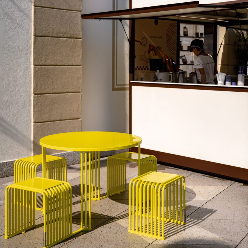 Yellow dining set outside coffee kiosk