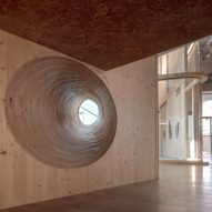 A wood wall with a circular hole