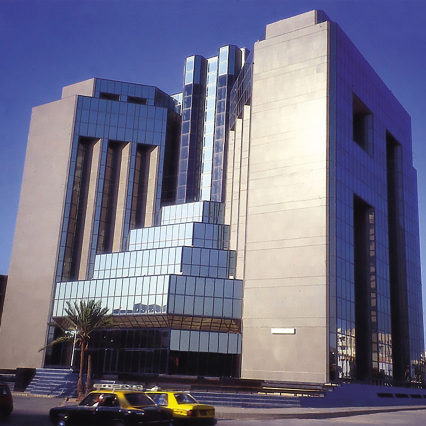 Exterior of the Pakistan State Oil House with two tall towers connected by a stepped glass structure