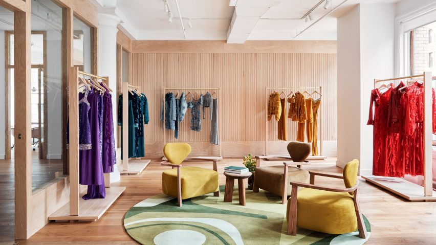 Showroom featuring colourful PatBo clothing displayed on racks