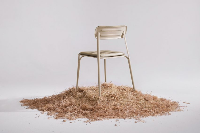 Rear view of PEEL chair by Prowl Studio on a bed of woodchips