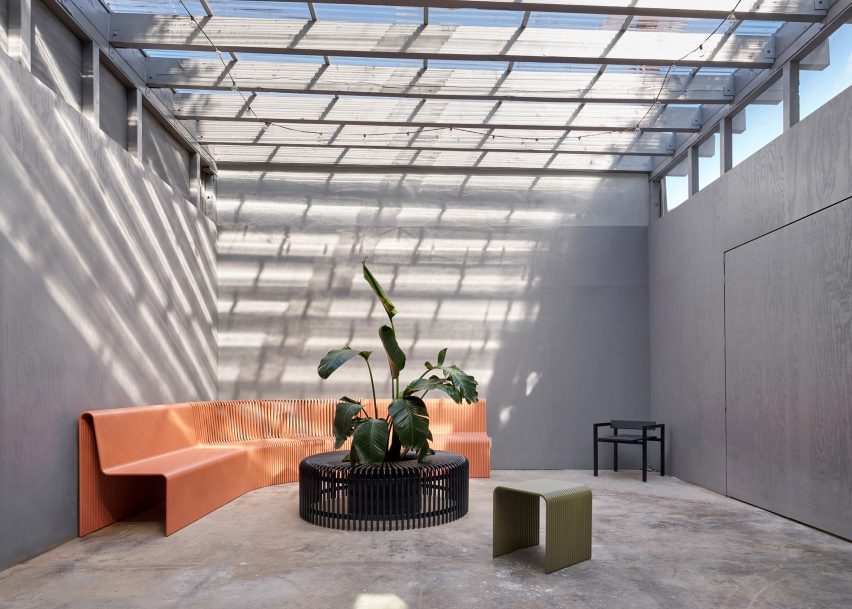 Enclosed patio with grey-stained plywood walls