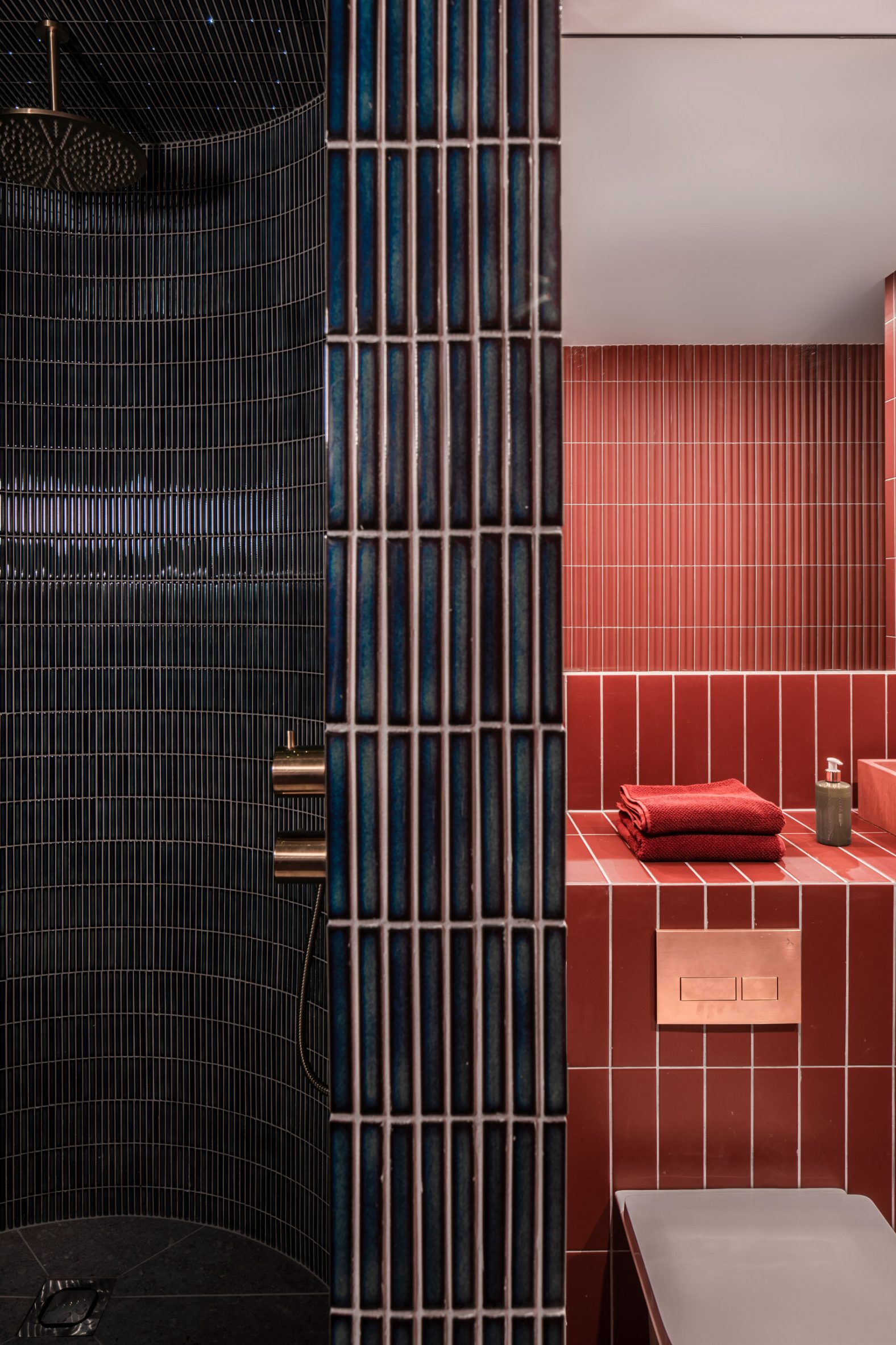 Jewel-toned shower room of Pink House by Courtney McDonnell Studio