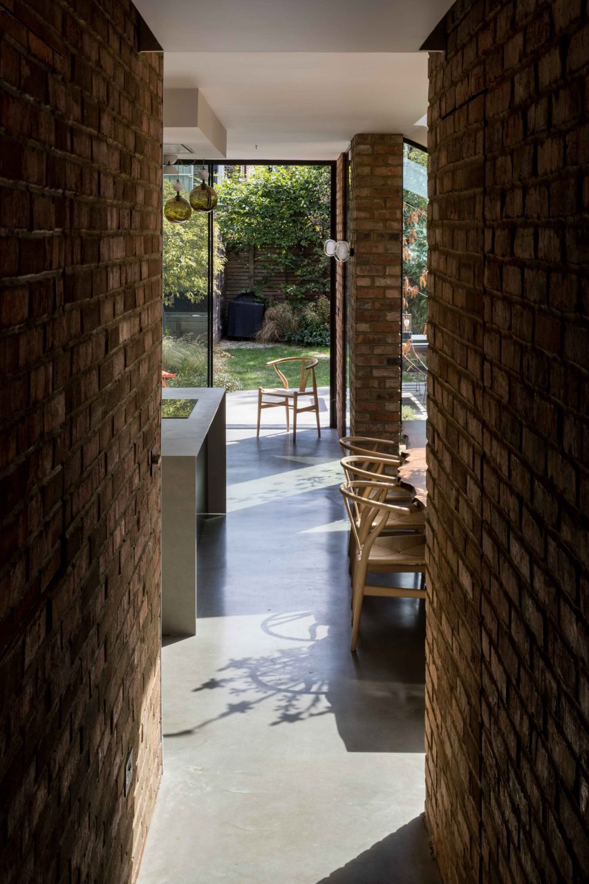 Brick-lined entrance to open-plan kitchen and diner