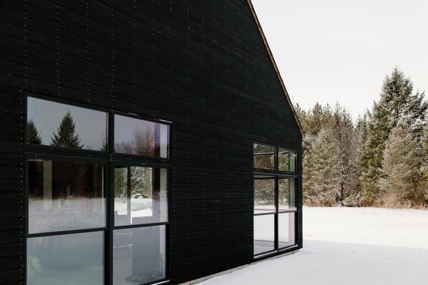 Charred wood home with glass