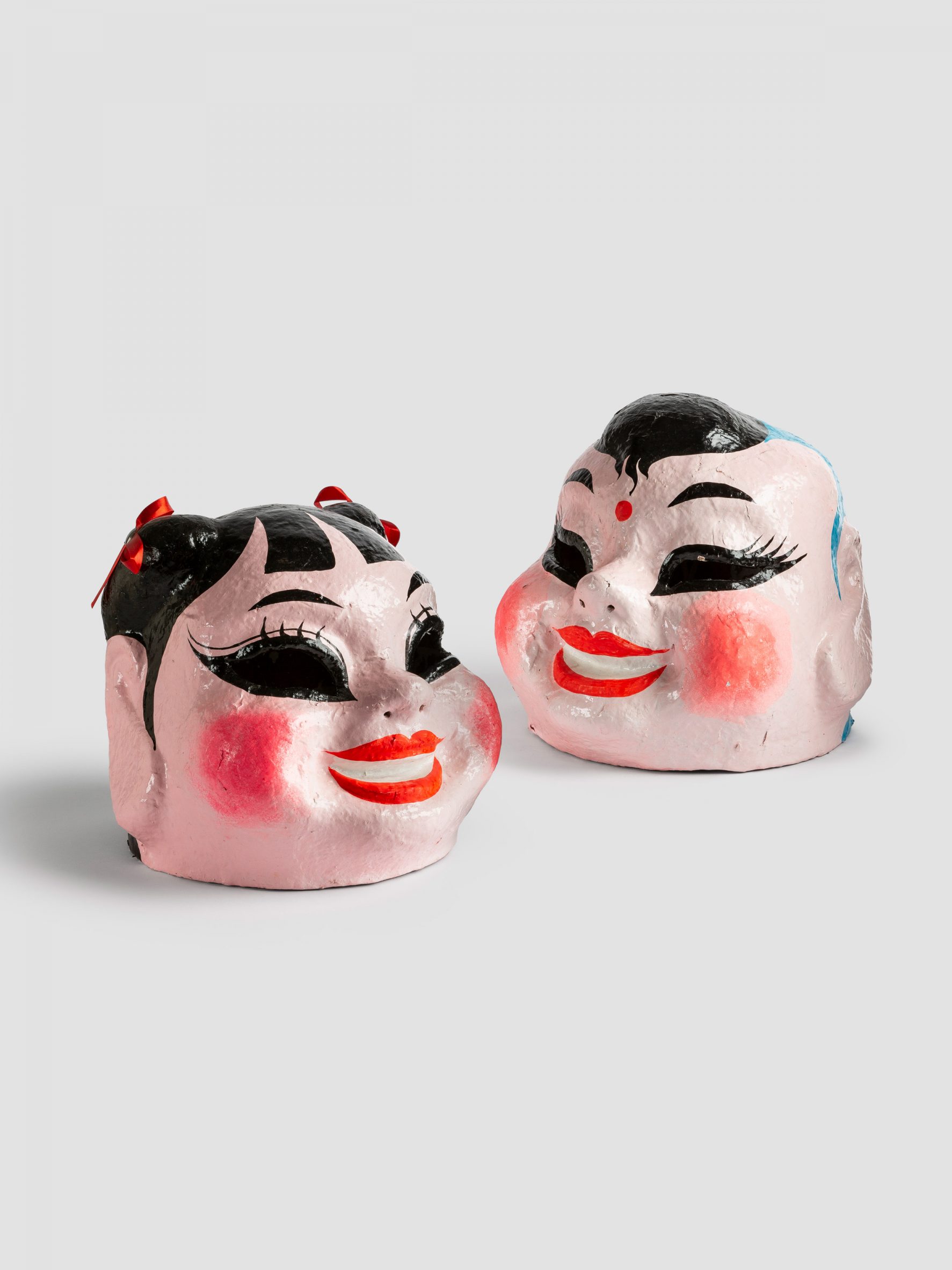 Masks of faces with red cheeks