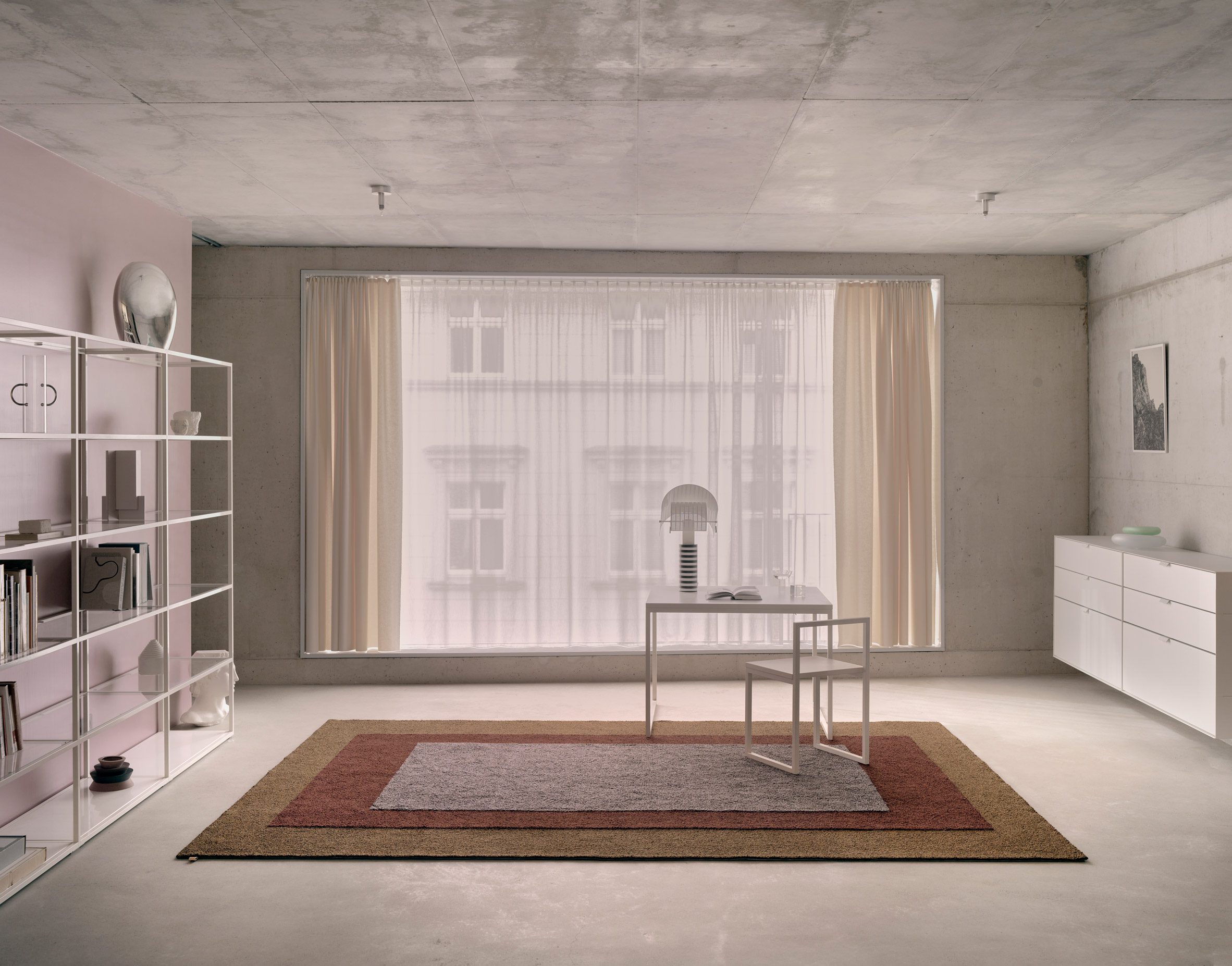 Concrete interior with Tegal rug by Kasthall
