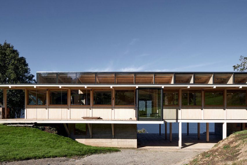 Timber home with a concrete lower level on a lake hillside