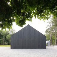 Gable end of a black timber barn-style home