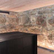 Basement with stone walls at the New York farmhouse by Worrell Yeung