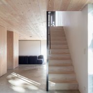 Interior wooden staircase at the New York farmhouse by Worrell Yeung
