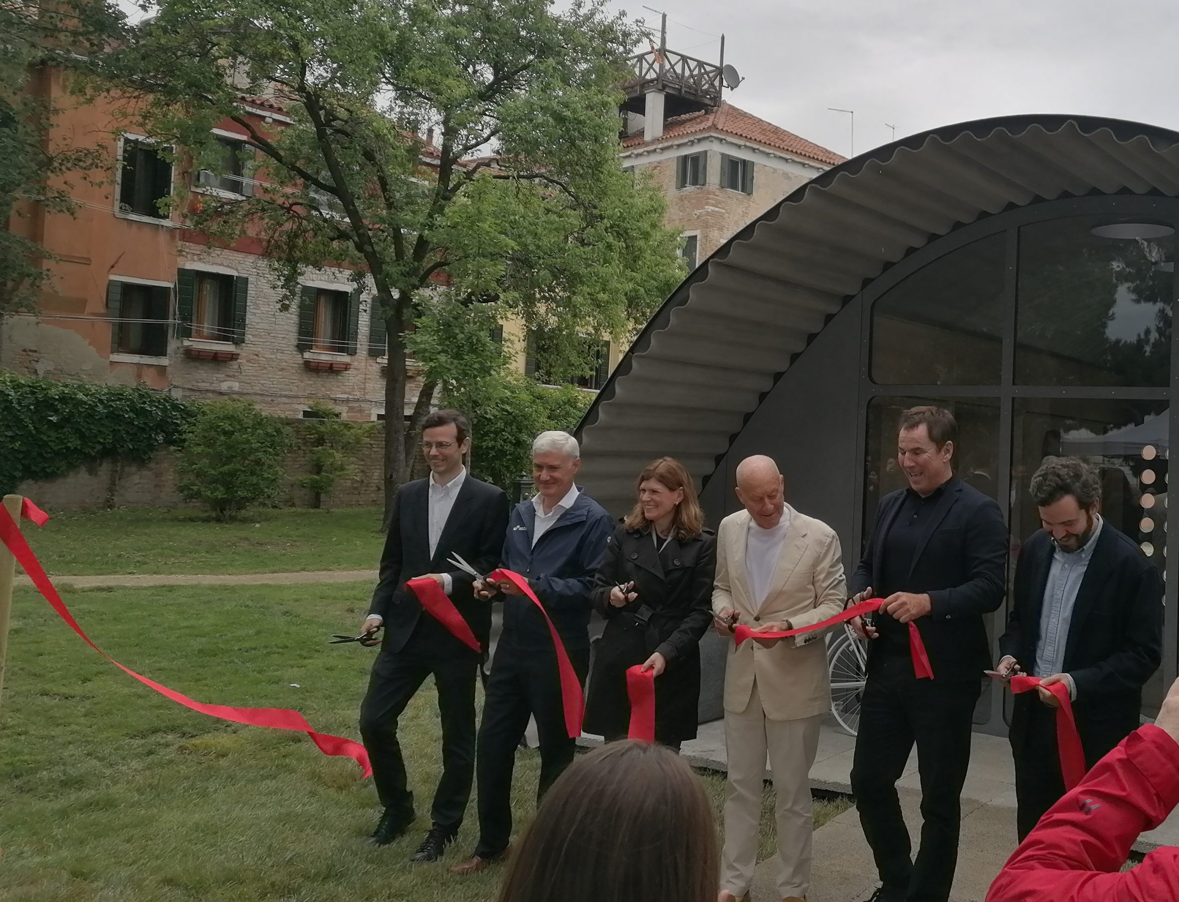 Norman Foster cutting the ribbon on his Essential Homes Research Project