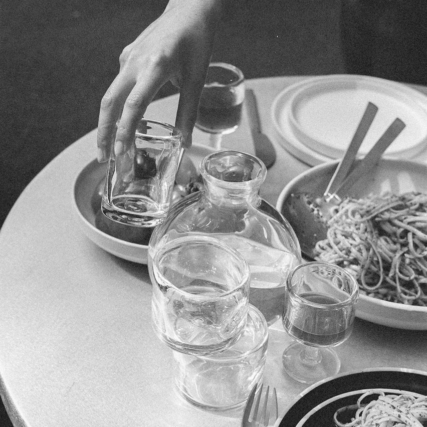 Black and white photo of tableware with food and drink