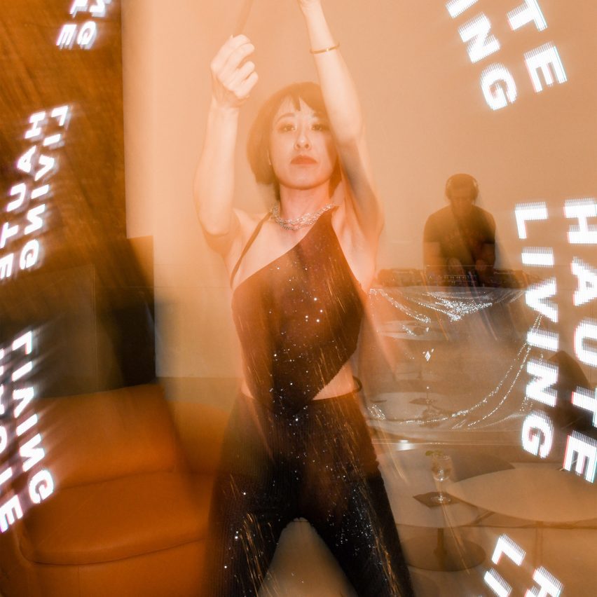 Photo of Haute Living logo and person dancing
