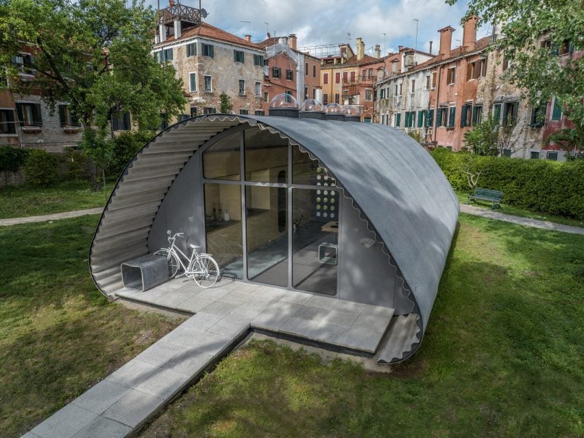 Photo of a grey housing pod designed by Norman Foster Association and Holcim