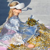Photo of a person in foil blankets wearing a VR headset