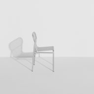 Shiny metallic chair in white room