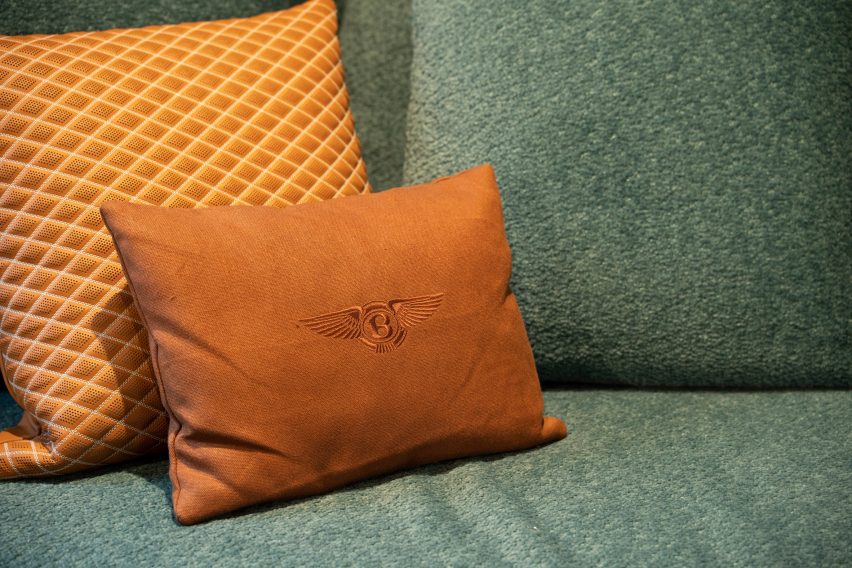 Orange pillow with Bentley logo