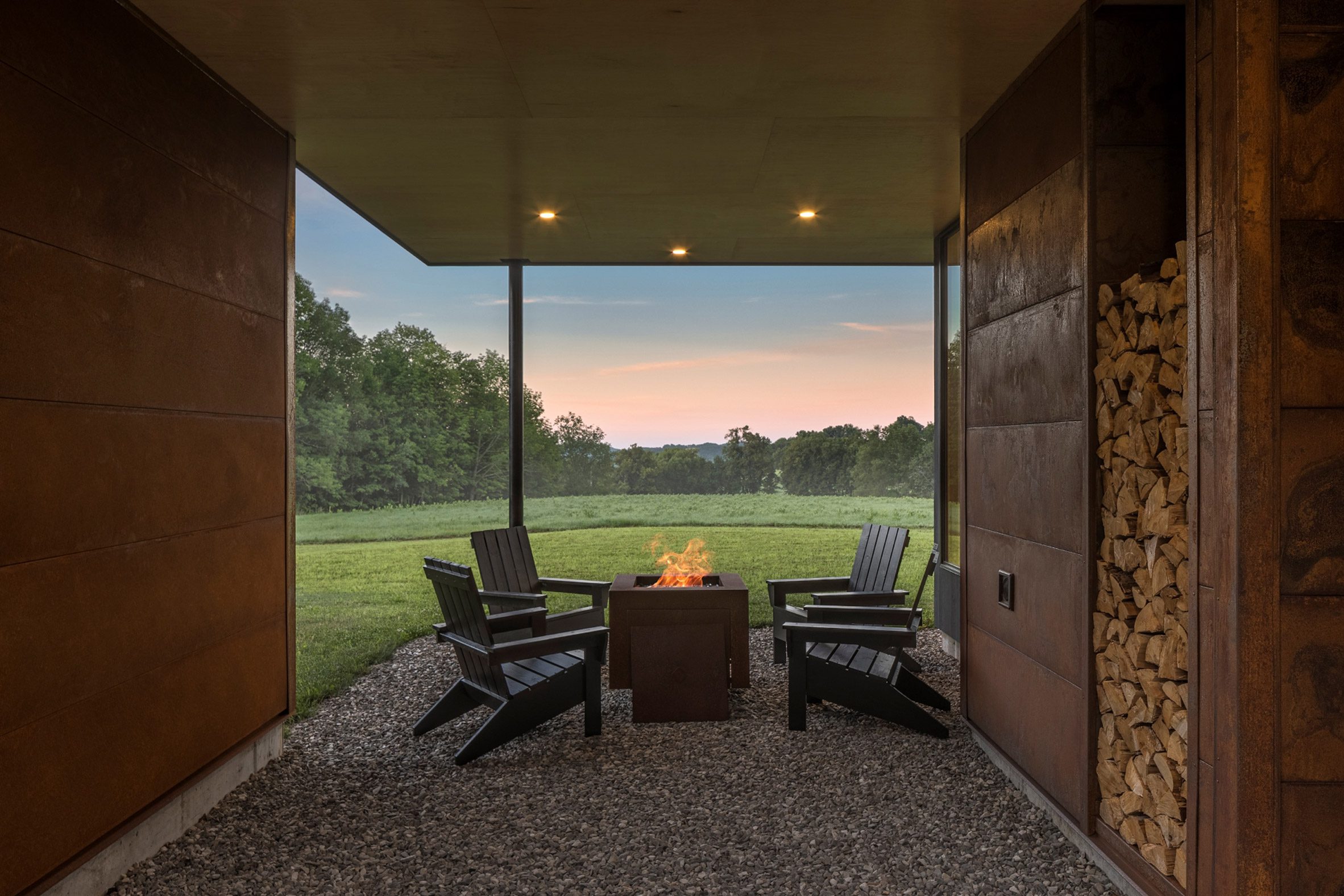 Fire pit and deck chairs at Bully Hill House by Studio MM