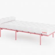 White day bed with pink frame on white backdrop